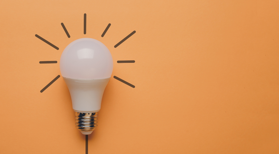 Light Bulb on Orange Background